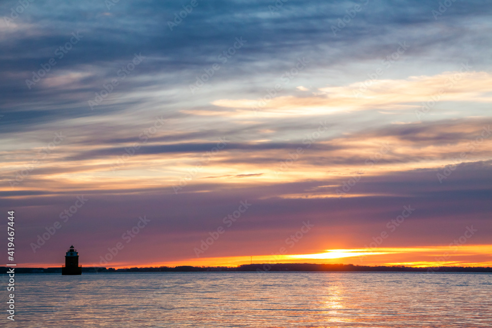 dramatic sunrise landscape photo in Sandy Point State Park,  Chesapeake Bay, Maryland.