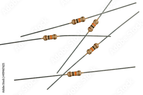 The resistor is carbon. Lying in a heap.  The main component in electronics. Close up, isolated. photo