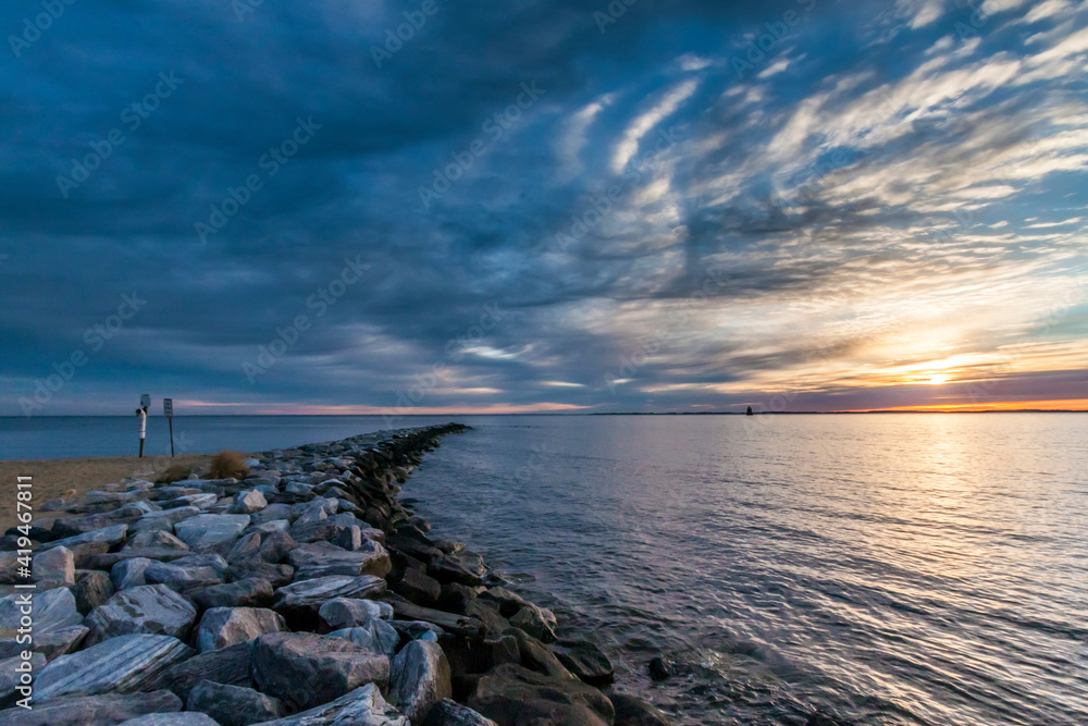 dramatic sunrise landscape photo in Sandy Point State Park,  Chesapeake Bay, Maryland.
