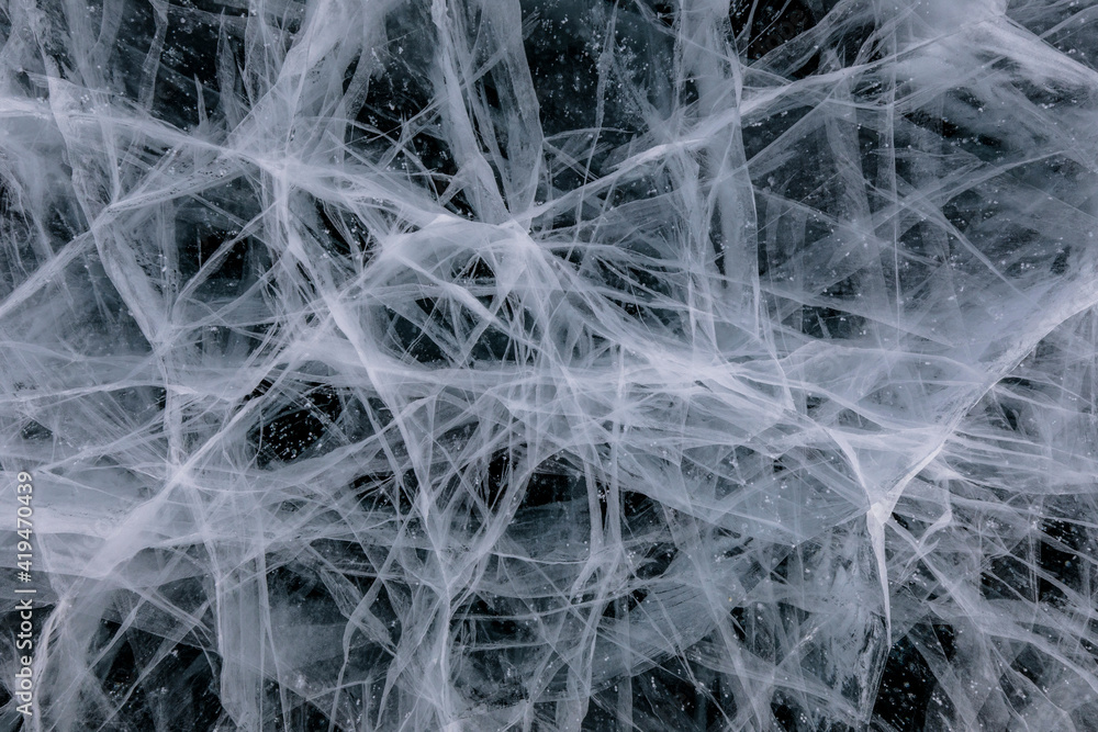From above of frozen Lake Baikal surface with chaotic pattern and cracks as abstract background From above of frozen Lake Baikal surface with chaotic pattern and cracks as abstract background