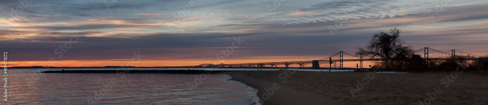 dramatic spring sunrise in Chesapeake bay and Key Bridge in Maryland.