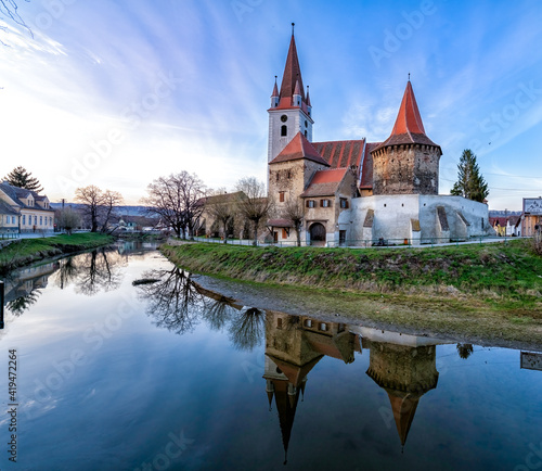Fortified church of Cristian from Sibiu Hermannstadt. Transylvania, Romania, Medieval Church reflection in water. Medieval Architecture