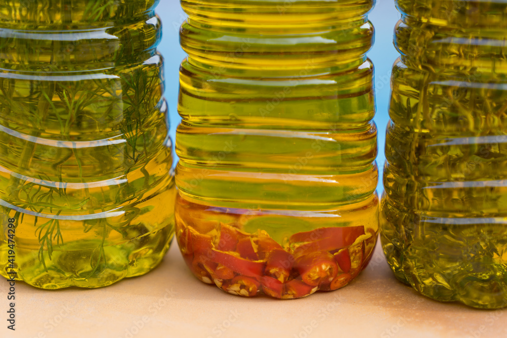 selection of aromatic olive oils enriched with spicy chili and mediterranean herbs selection of aromatic olive oils enriched with spicy chili and mediterranean herbs