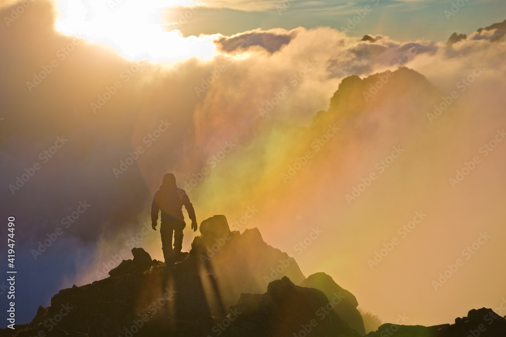 Climbing man in rainbow - colored