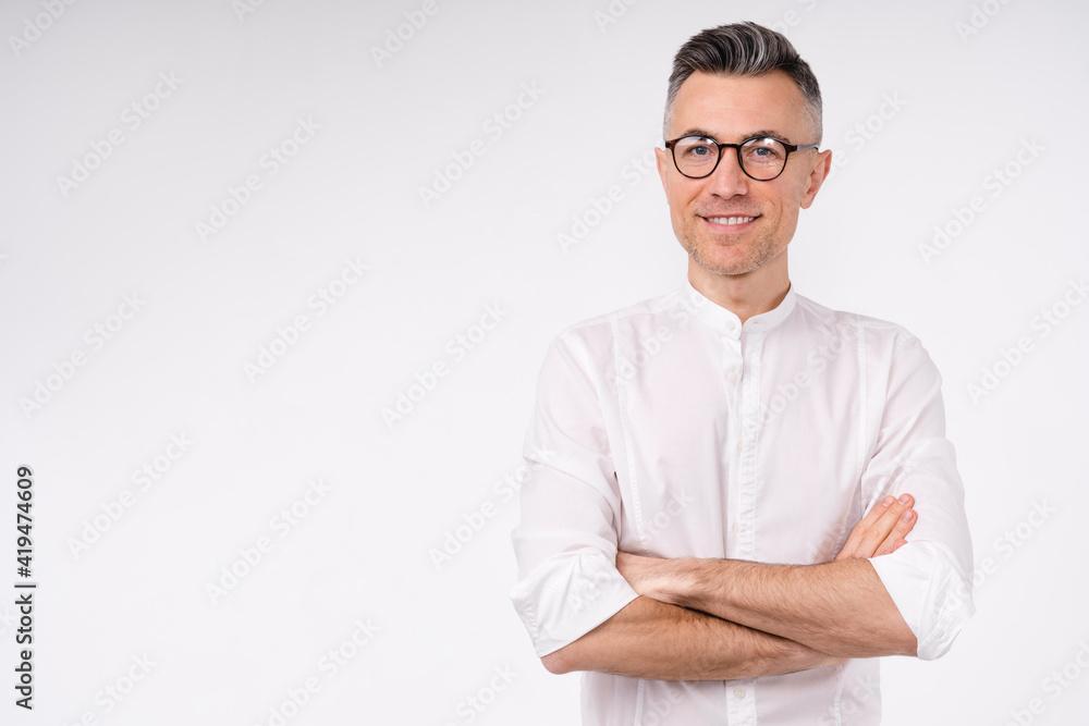 Confident middle-aged caucasian businessman in white shirt and glasses isolated over white background Confident middle-aged caucasian businessman in white shirt and glasses isolated over white background