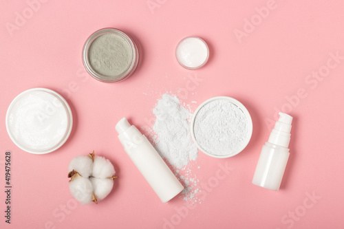 Alginate and clay face masks. Cosmetic products, masks and creams in jars. Top view, flat lay