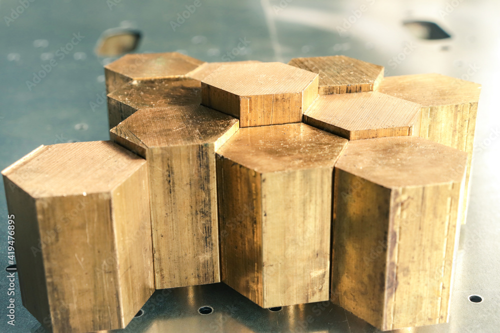 Hexagonal brass bars for machining on CNC metalworking machines. Brass products manufacturing 