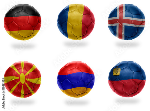 europe group J . football balls with national flags of germany, romania, iceland, macedonia, armenia, liechtenstein , soccer teams