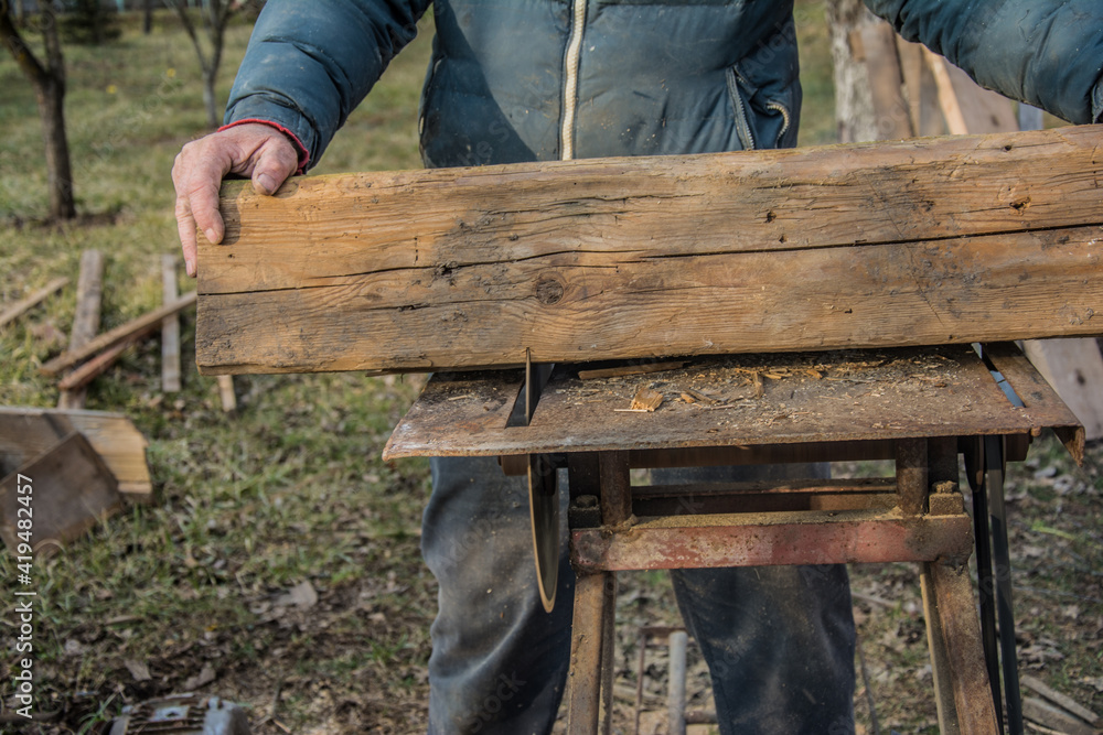 Carpenter's Hands Cutting Wood With Tablesaw Carpenter's Hands Cutting Wood With Tablesaw