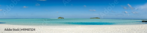 panorama of tropical beach with two isolated uninhabited islands © mathilde