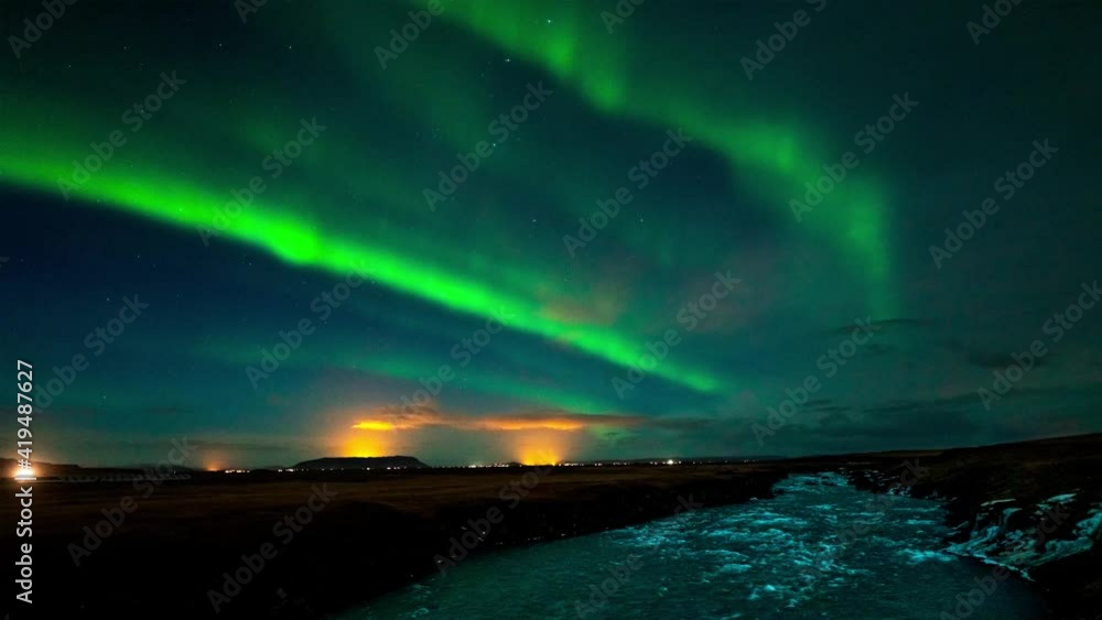 Vivid green Northern lights over Thjorsa river in south Iceland - time lapse video Vivid green Northern lights over Thjorsa river in south Iceland - time lapse video