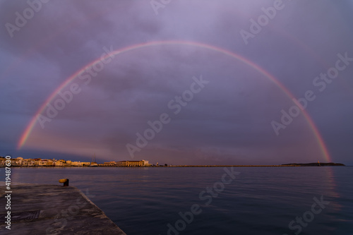 Fototapeta Naklejka Na Ścianę i Meble -  An amazing rainbow over the city of Hermoupolis
