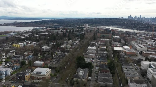 Cinematic aerial drone dolly shot of University District, Bryant, Northlake, North Broadway, Laurelhurst, I-5 freeway with Lake Union, Union Bay, Lake Washington and downtown Seattle in the distance photo