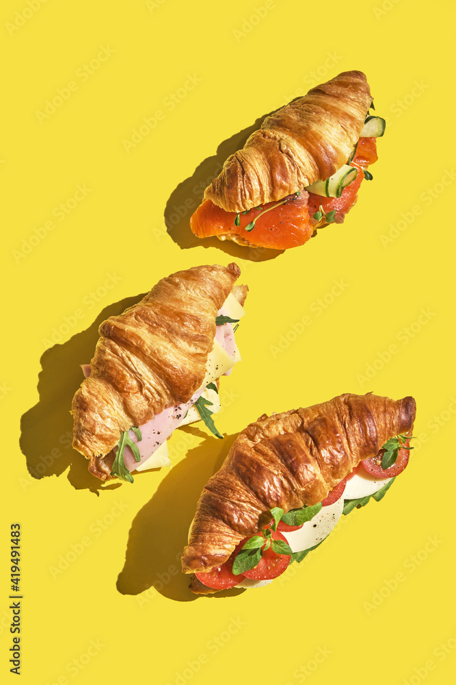 croissant sandwich with salmon, ham and cheese croissant sandwich with salmon, ham and cheese