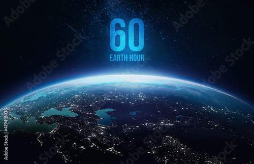 Earth Hour event. Planet Earth in dark outer space. Orbit and surface. Elements of this image furnished by NASA