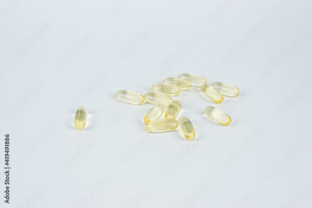 Vitamins pills on the white background Vitamins pills on the white background