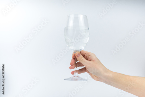 A glass with water on the white background