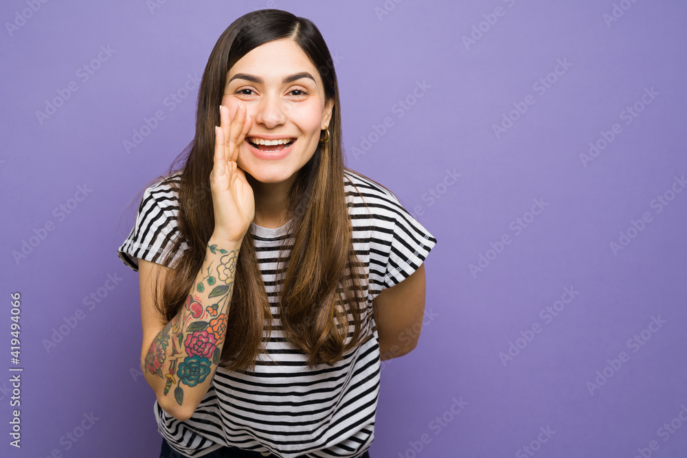 Latin woman in her 20s speaking softly a secret Latin woman in her 20s speaking softly a secret