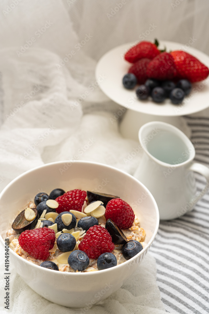 Oatmeal Porridge With Fresh Berries, Oats With Blueberry And Raspberry on white background.Rustic food photographhy. Oatmeal Porridge With Fresh Berries, Oats With Blueberry And Raspberry on white background.Rustic food photographhy.