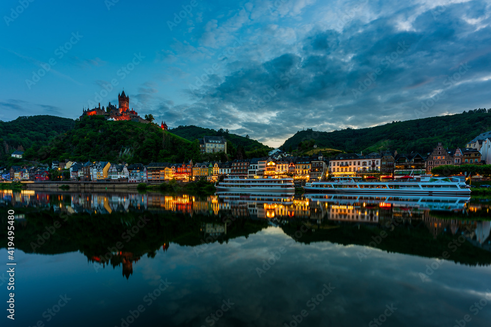 Moselle with city lights from Cochem at night, Germany..Imperial Castle of Cochem.
