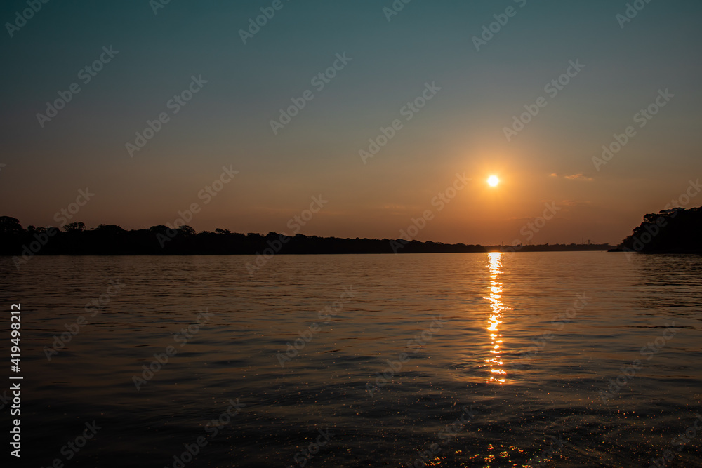 sunset over the river Amazon sunset over the river Amazon