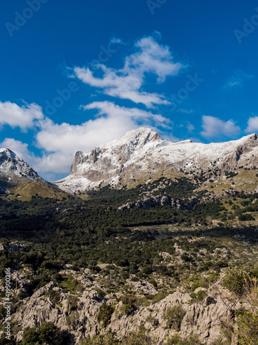 mountains with snow and clouds in the tramuntana area on the balearic island of mallorca, spain