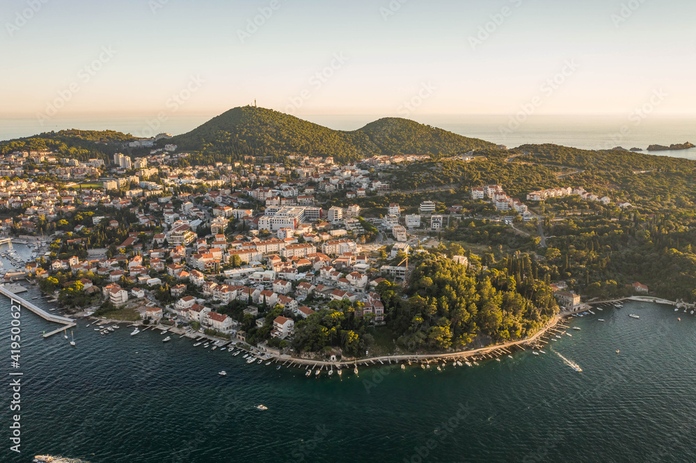 Aerial drone shot of Babin Kuk residential hill area in Dubrovnik in Adriatic sea in Croatia summer sunset