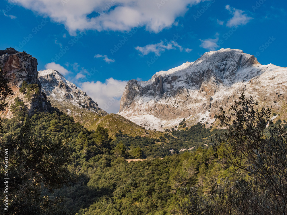 mountains with snow  and clouds in the tramuntana area on the balearic island of mallorca, spain
