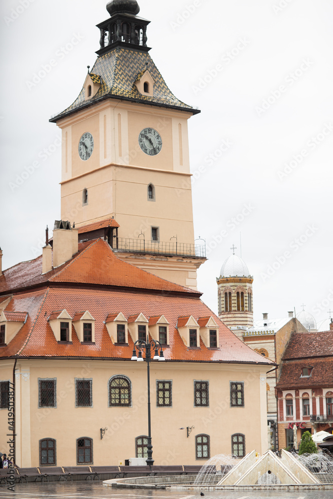 Beautiful ancient streets of Brasov, Romania. Medieval architecture. Beautiful places and landscapes. Cafes, churches, council square. Old town in rainy weather.