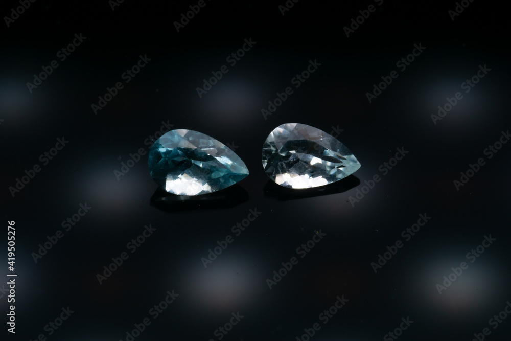 Natural stone blue topaz on a black background Natural stone blue topaz on a black background