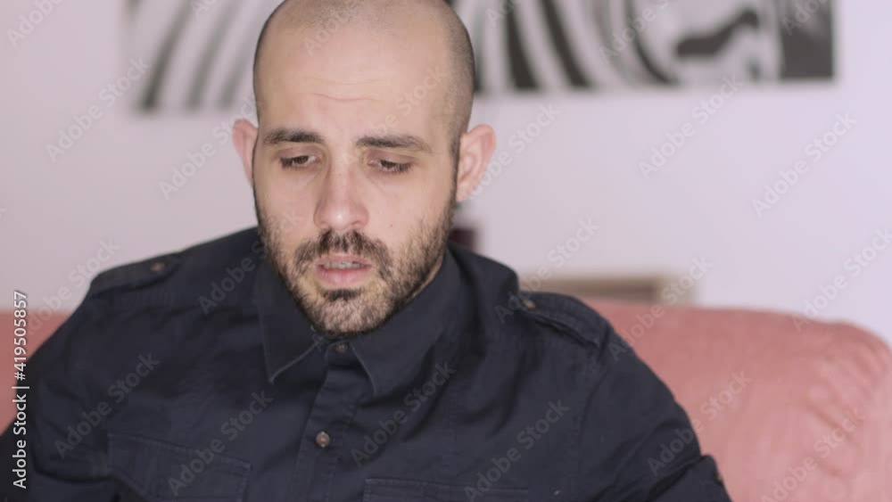 Depressed, worry and alone man. Anxiety and frustration concept. Frustrated man on the sofa Depressed, worry and alone man. Anxiety and frustration concept. Frustrated man on the sofa