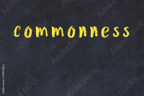 College chalk desk with the word commonness written on in photo