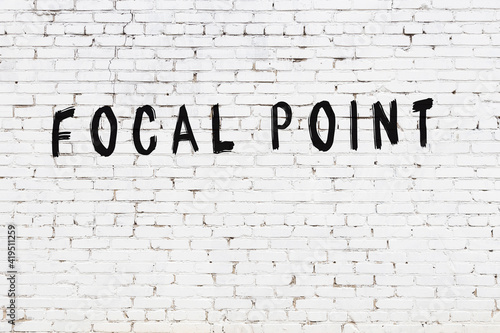 Inscription focal point painted on white brick wall