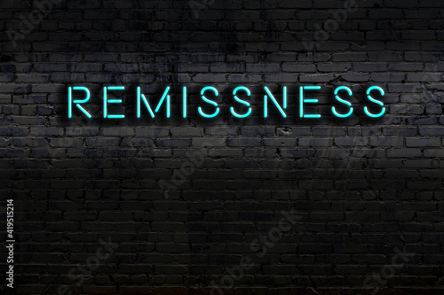 Fotografía Night view of neon sign on brick wall with inscription remissness