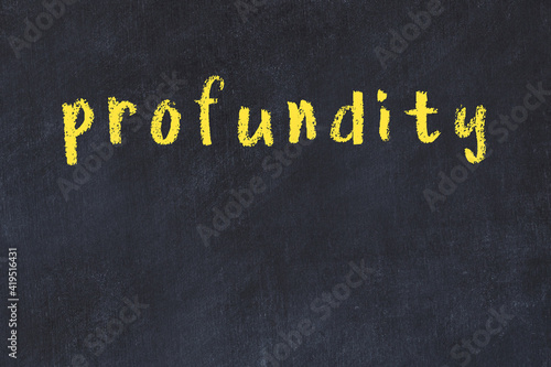 College chalk desk with the word profundity written on in