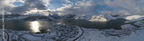 snowy reservoir in high mountain in panoramic from aerial view photo