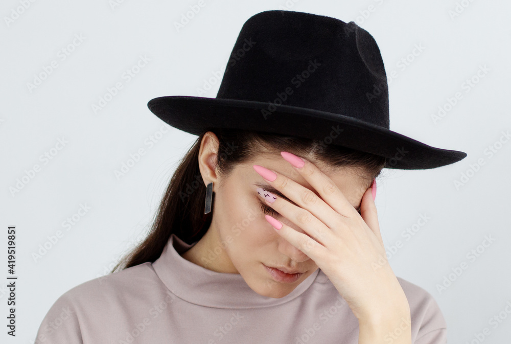 Facepalm embarrassment and shame emotion. ashamed smiling girl covering her face with a hand. young beautiful woman portrait on white background. Facepalm embarrassment and shame emotion. ashamed smiling girl covering her face with a hand. young beautiful woman portrait on white background.