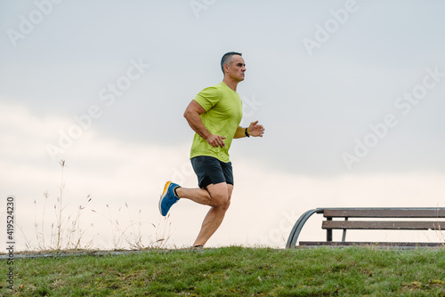 Older athlete exercising outdoors