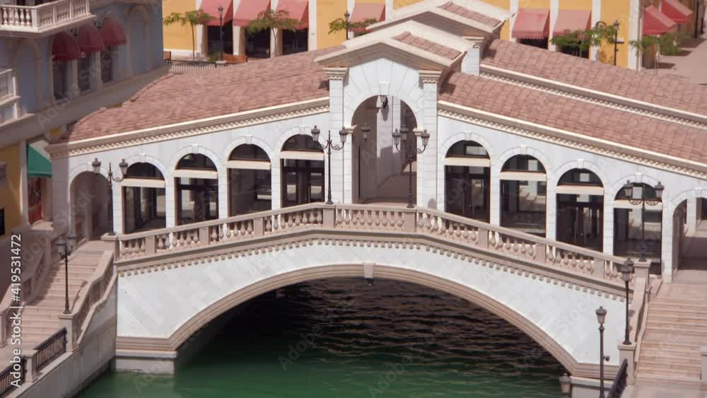 Lockdown: Green Water In Canal Runs Under Stunning Covered Footbridge In Beautiful Courtyard