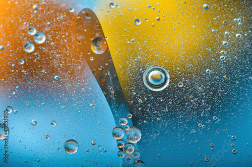 Colorful abstract background. effect of colored oil circles and air bubbles on the water.Rainbow effect psychedelic abstract background.