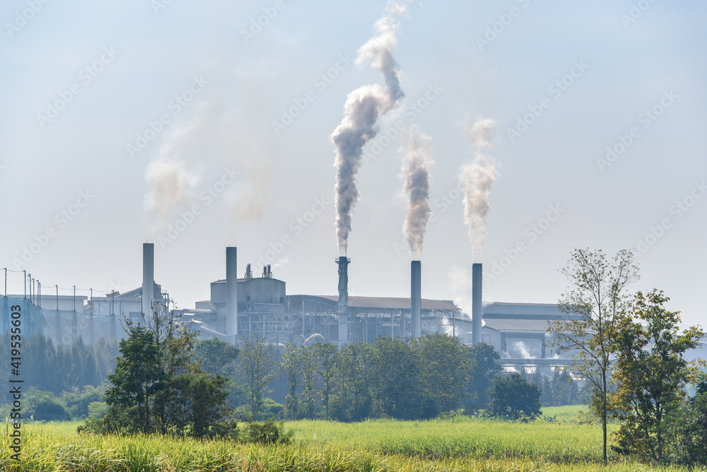 White smoke comes out from smokestacks or exhaust pipes. Factory chimneys emit water vapor which condenses into a whitish cloud before evaporating. Condensed droplets released from five exhaust pipes