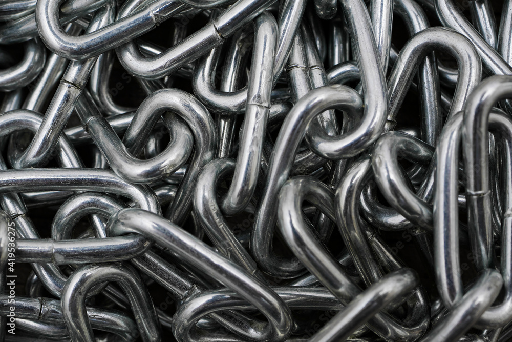 macro of metal chain links in heap