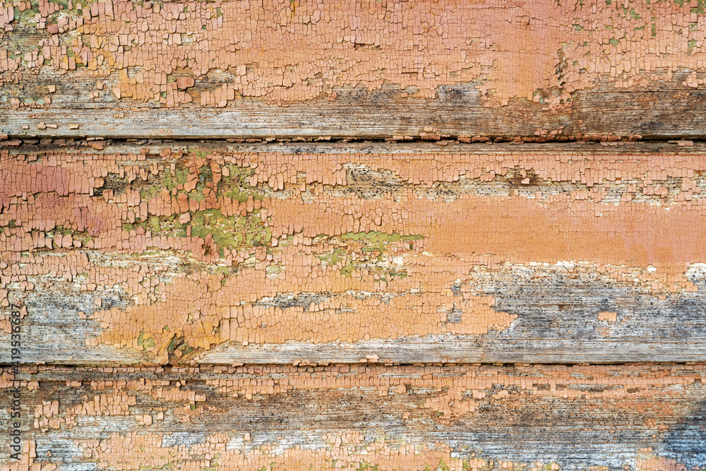 Brown orange boards. Old, cracked and peeled paint. Aged dilapidated wall. Rustic background. Place for text, copy space. Brown orange boards. Old, cracked and peeled paint. Aged dilapidated wall. Rustic background. Place for text, copy space.