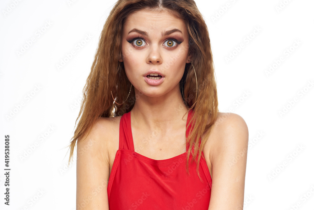 Pretty woman red tank top wavy hair attractive look hotel lifestyle light background Pretty woman red tank top wavy hair attractive look hotel lifestyle light background