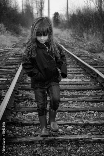 child on railroad