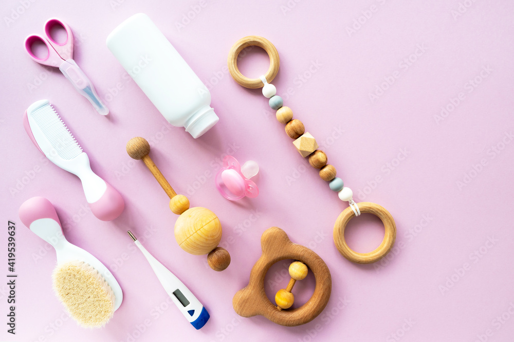 Baby care kit on pink background, top view, copyspace. Concept of children's hygiene. Flat composition with children's accessories, background. Baby care kit on pink background, top view, copyspace. Concept of children's hygiene. Flat composition with children's accessories, background.