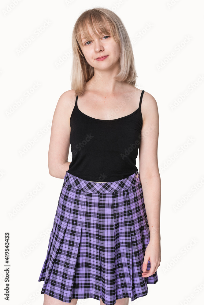 Blonde girl in black tank top and purple pleated skirt grunge fashion Blonde girl in black tank top and purple pleated skirt grunge fashion