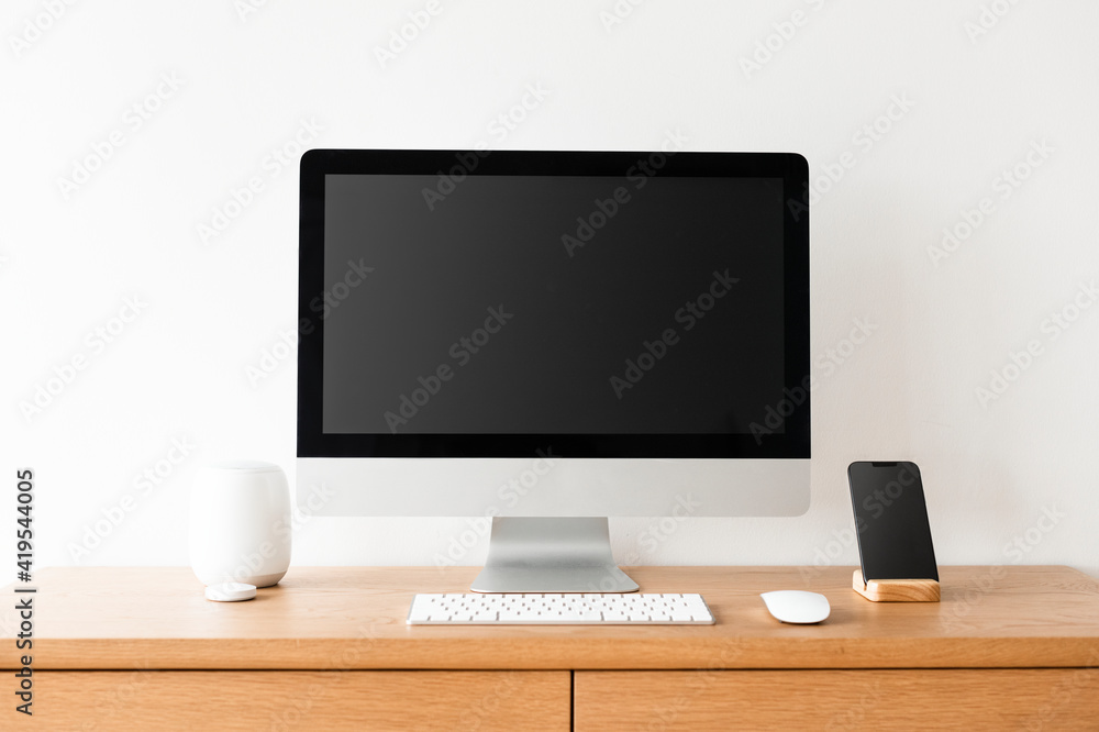 Blank computer screen on a table Blank computer screen on a table