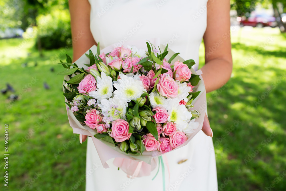 Beautiful wedding bouquet of flowers in the hands of the bride Beautiful wedding bouquet of flowers in the hands of the bride
