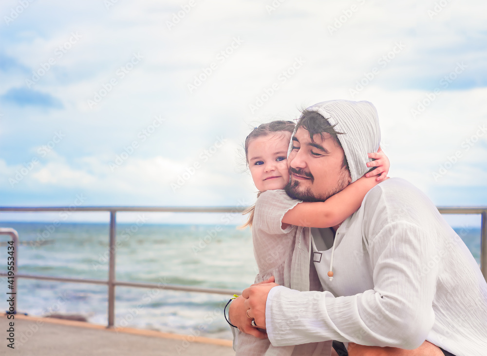 Father and daughter hugs on the walk